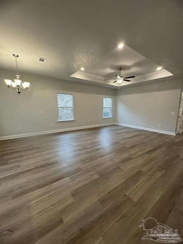 1636 Slate Dr, Cantonment, FL 32533 - spare room featuring a raised ceiling, baseboards, a chandelier, a ceiling fan, and recessed lighting