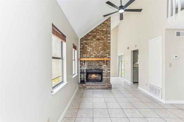 unfurnished living room with visible vents, a ceiling fan, and plenty of natural light