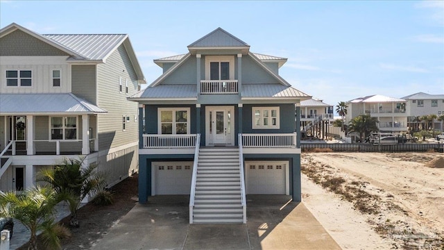 view of front of house with a garage and a balcony