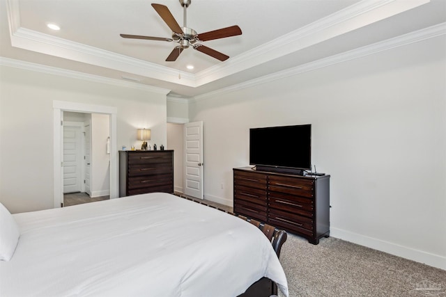 carpeted bedroom with a raised ceiling, ceiling fan, and crown molding