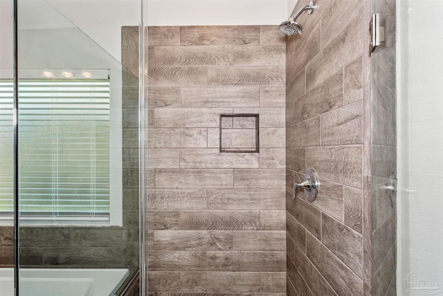 bathroom with tiled shower