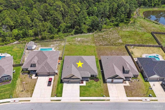 bird's eye view with a water view