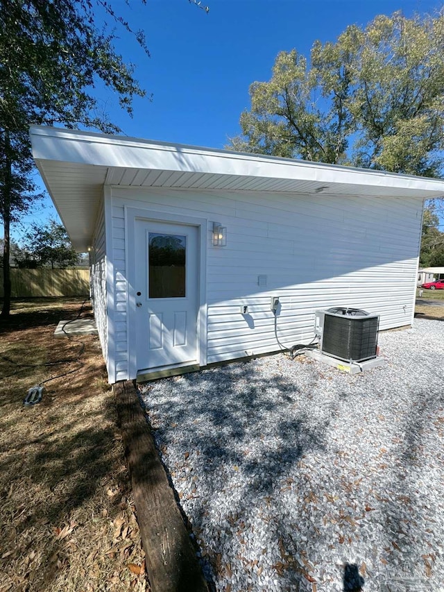 exterior space featuring central AC and an outdoor structure