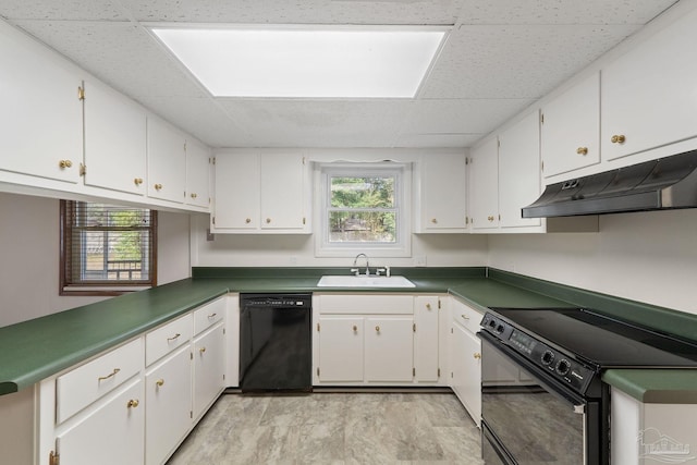 kitchen featuring sink, white cabinetry, a paneled ceiling, and black appliances