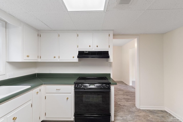 kitchen with white cabinets, sink, and black electric range