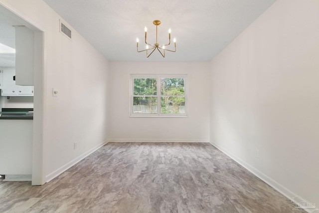 unfurnished dining area featuring a chandelier