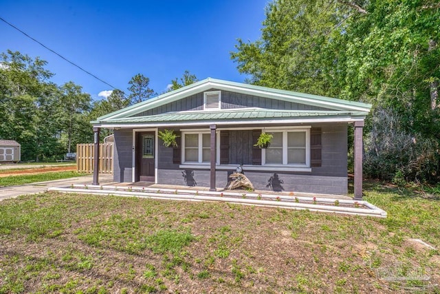 3171 Montecito Blvd, Milton, FL 32583 - bungalow with concrete block siding and a porch