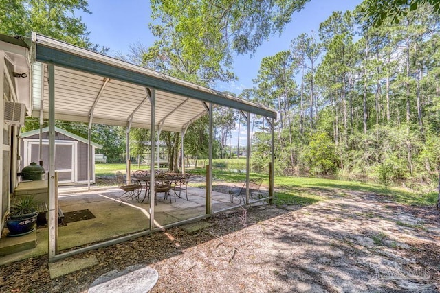 3171 Montecito Blvd, Milton, FL 32583 - view of yard with a shed, a patio, and an outbuilding