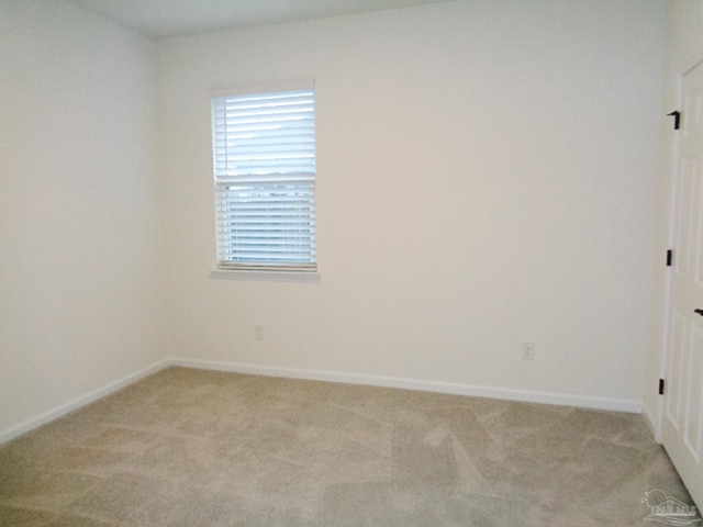 empty room featuring light colored carpet