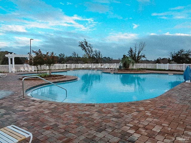 view of swimming pool with a patio area