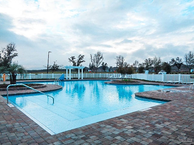 view of swimming pool featuring a patio