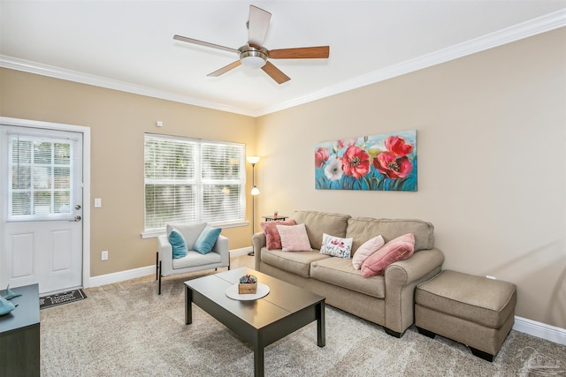 living room featuring ceiling fan, crown molding, and light carpet