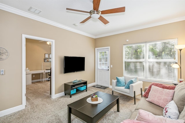 living room with light carpet, visible vents, a wealth of natural light, and ornamental molding