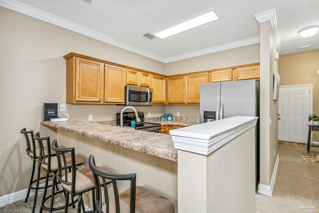 kitchen with light tile patterned floors, visible vents, a peninsula, light countertops, and appliances with stainless steel finishes