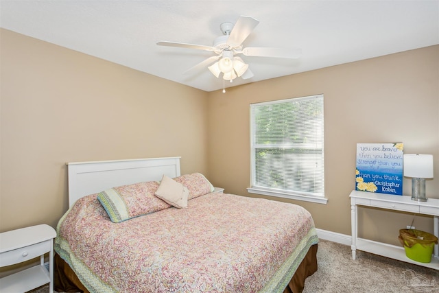 carpeted bedroom with ceiling fan