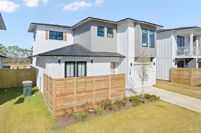 13844 Red Drum Ct, Perdido Key, FL 32507 - view of front of home featuring board and batten siding and concrete driveway