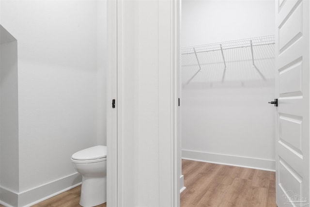 13844 Red Drum Ct, Perdido Key, FL 32507 - bathroom featuring wood finished floors and toilet