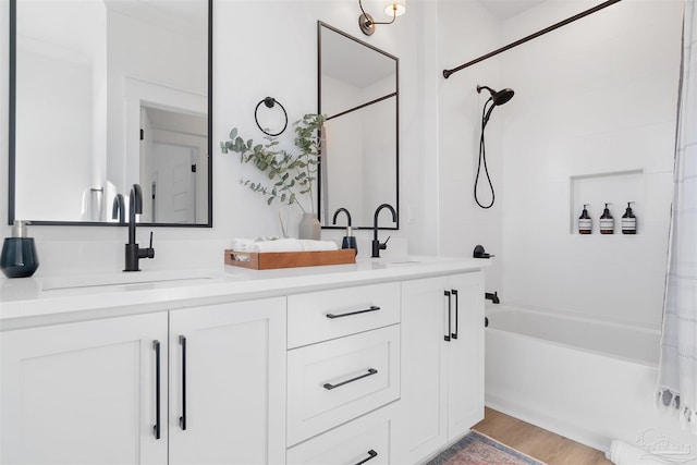 13844 Red Drum Ct, Perdido Key, FL 32507 - bathroom featuring shower / tub combo, double vanity, and wood finished floors