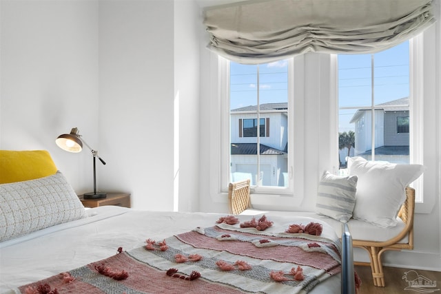 13844 Red Drum Ct, Perdido Key, FL 32507 - bedroom with multiple windows and wood finished floors