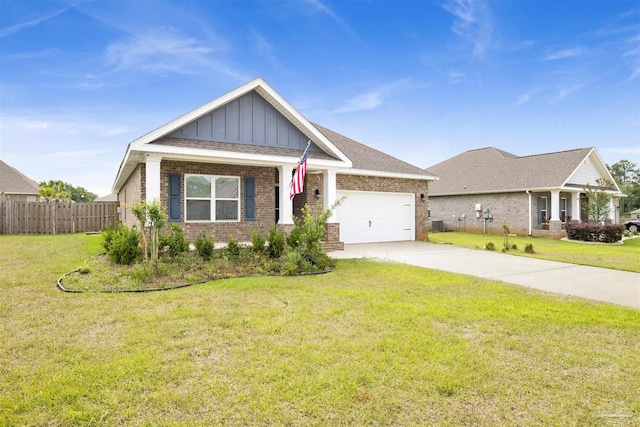 craftsman-style home featuring brick siding, fence, concrete driveway, and an attached garage
