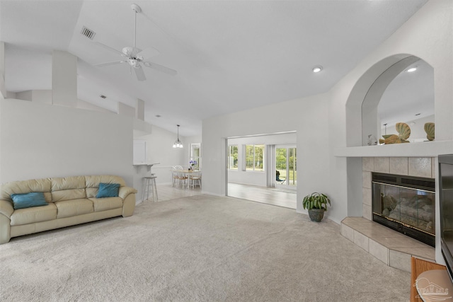 carpeted living area featuring visible vents, high vaulted ceiling, a ceiling fan, recessed lighting, and a fireplace