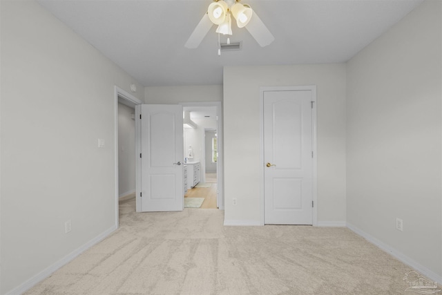 unfurnished bedroom with visible vents, ceiling fan, baseboards, and carpet floors