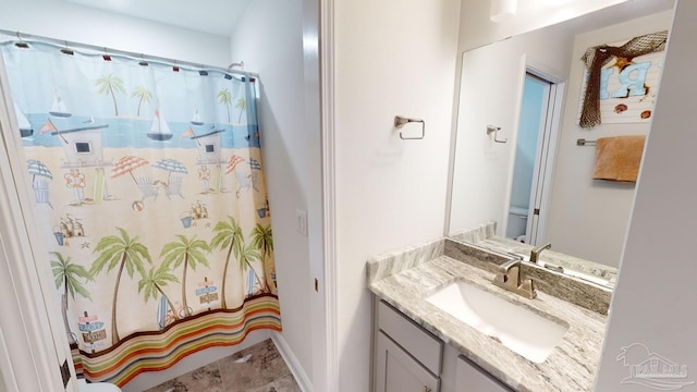 bathroom with vanity and walk in shower