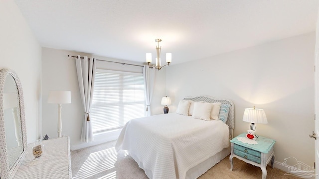 carpeted bedroom featuring a chandelier