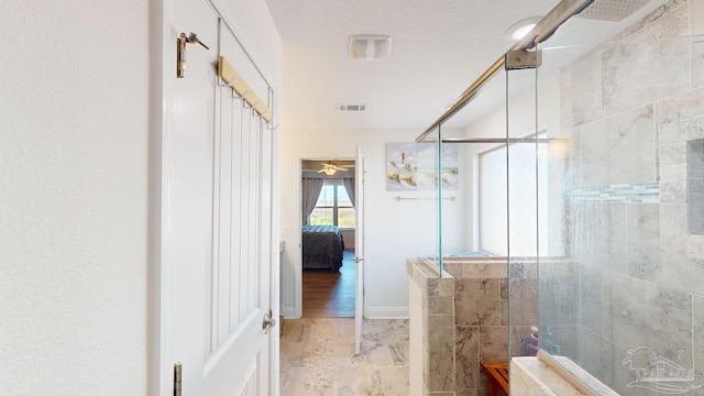 bathroom with a shower with shower door