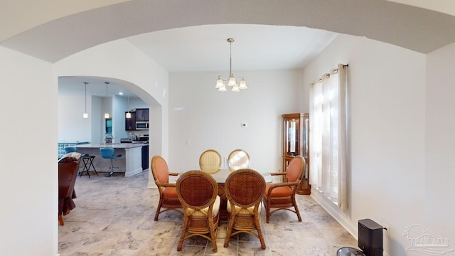 dining space featuring a chandelier