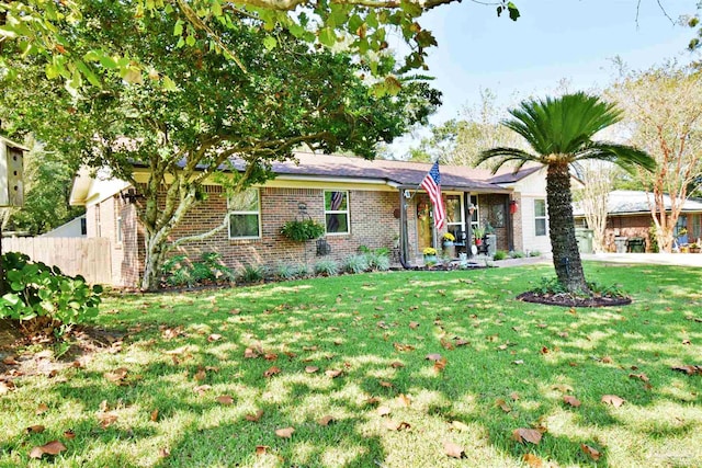 ranch-style home with a front yard