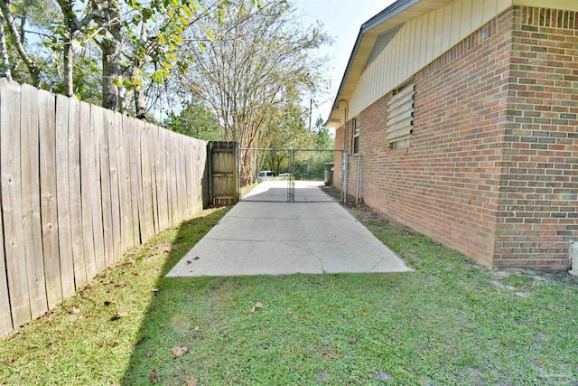 exterior space with a lawn and a patio area