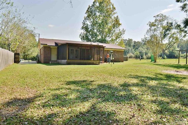 view of yard featuring a sunroom