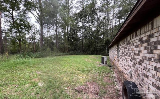 view of yard with central AC unit