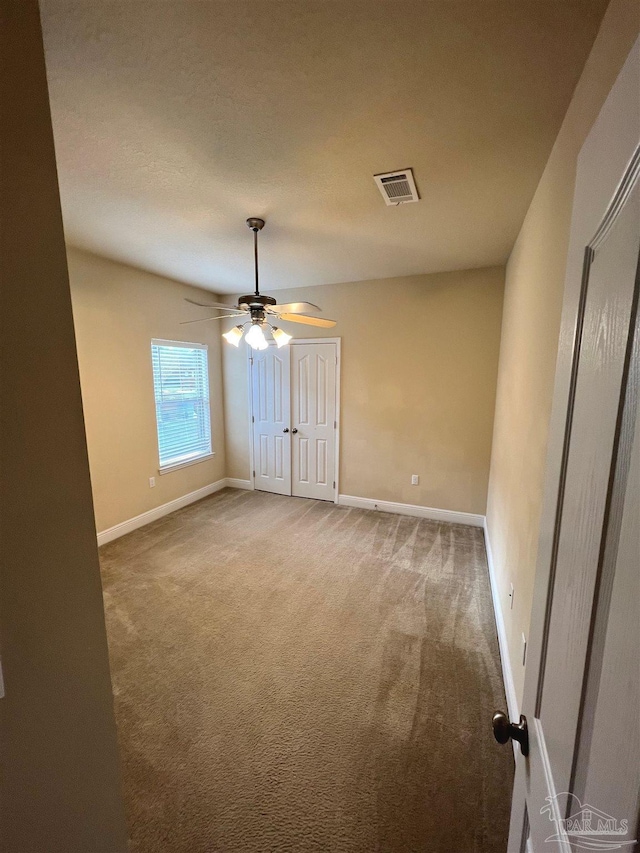 3026 Windward Cove Ct, Gulf Breeze, FL 32563 - carpeted spare room featuring a ceiling fan and baseboards