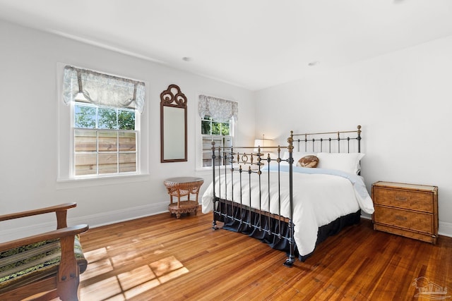 bedroom with hardwood / wood-style floors