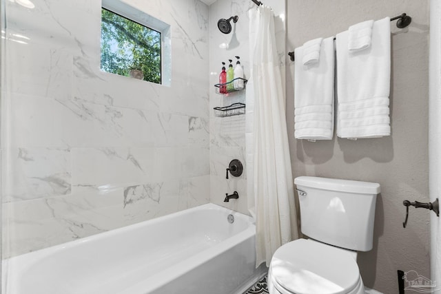 bathroom featuring toilet and shower / bath combination with curtain