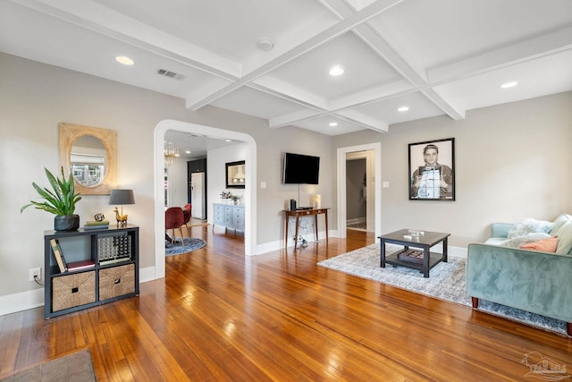 living room featuring wood-type flooring, beamed ceiling, and coffered ceiling