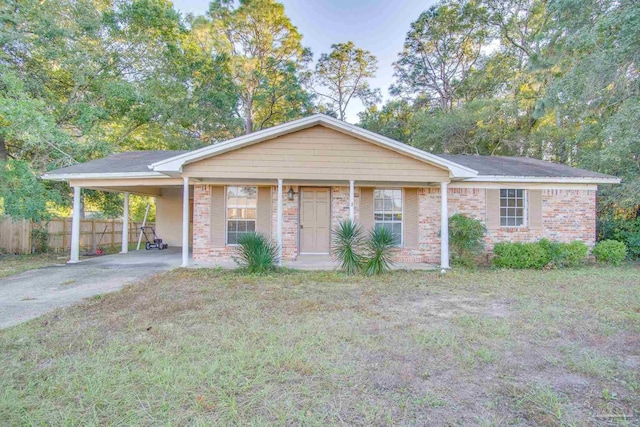 single story home featuring a carport and a front lawn