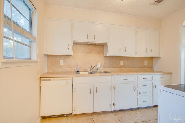 kitchen with tasteful backsplash, white cabinetry, sink, and white appliances