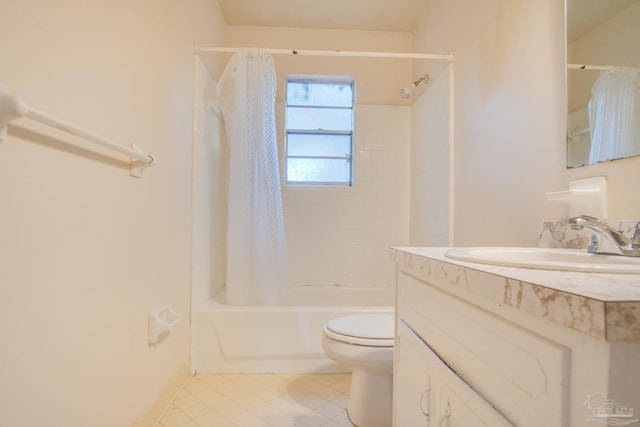 full bathroom featuring tile patterned floors, vanity, toilet, and shower / tub combo