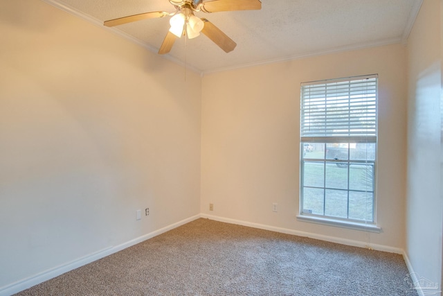 carpeted spare room with a textured ceiling, ceiling fan, and ornamental molding