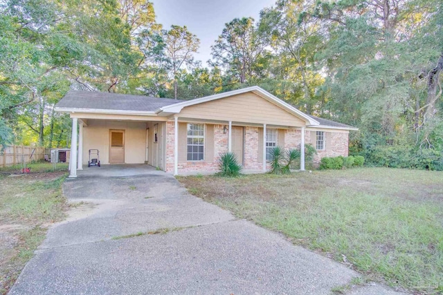 ranch-style house with a carport and a front yard