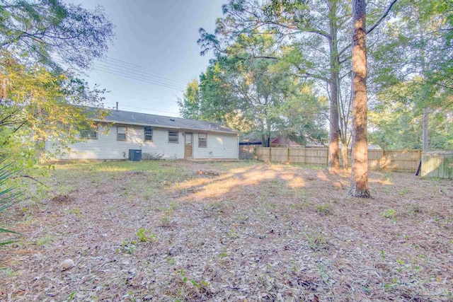 rear view of property with cooling unit