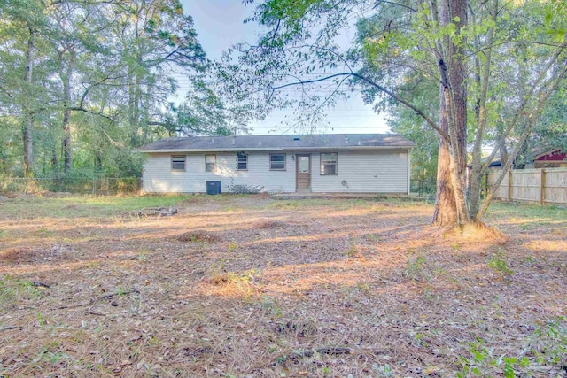 rear view of property with central AC unit