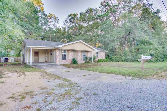 ranch-style house with a front lawn and a carport