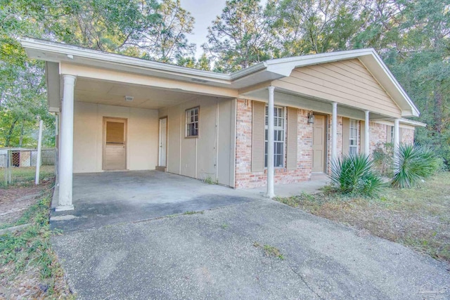 view of front of home featuring a carport