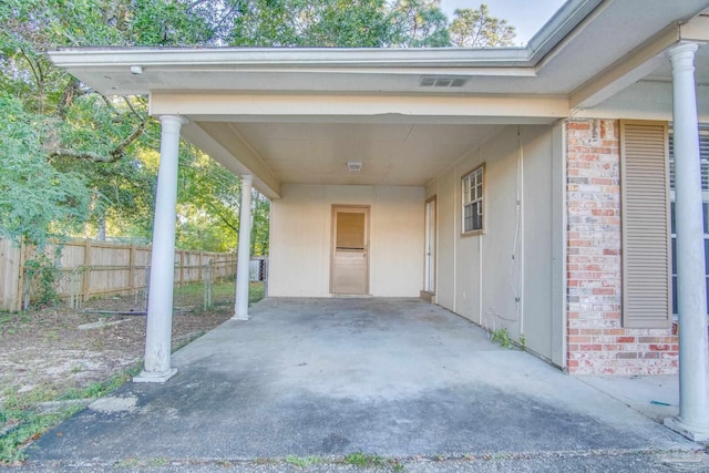 view of vehicle parking with a carport