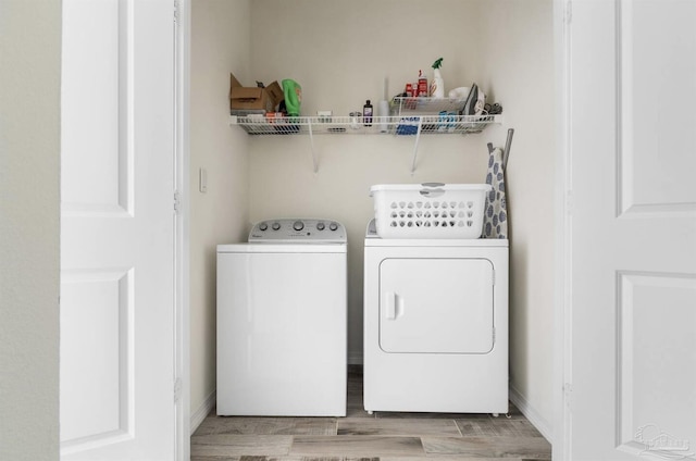 14478 Salt Meadow Dr, Pensacola, FL 32507 - laundry room with independent washer and dryer, wood finished floors, and baseboards