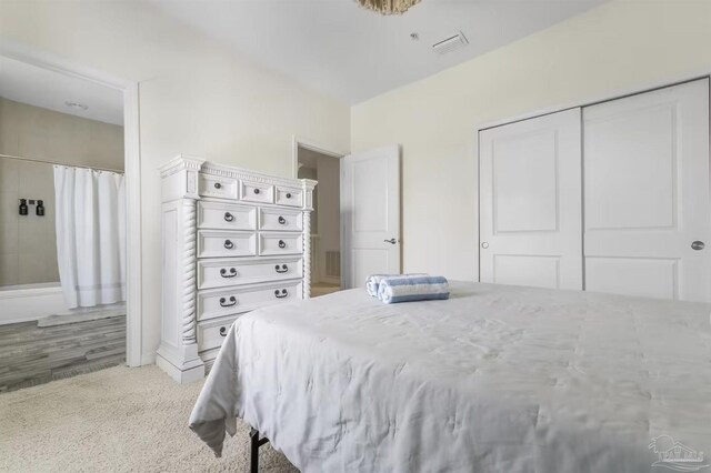 14478 Salt Meadow Dr, Pensacola, FL 32507 - bedroom featuring a closet and light colored carpet